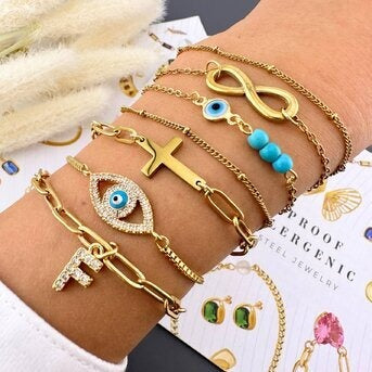 Pulseira "Cruzes", Aço banhado a ouro 18K